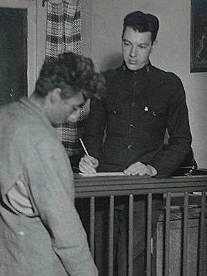 Cadet Frank Moss assisting homeless man